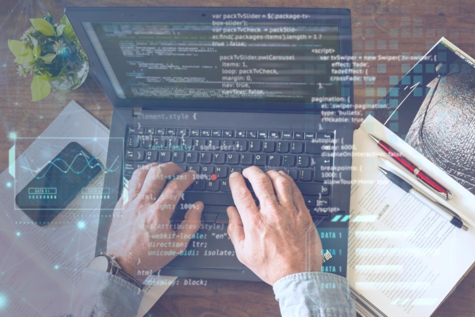 Software testing workspace with multiple monitors displaying test scenarios and debugging tools